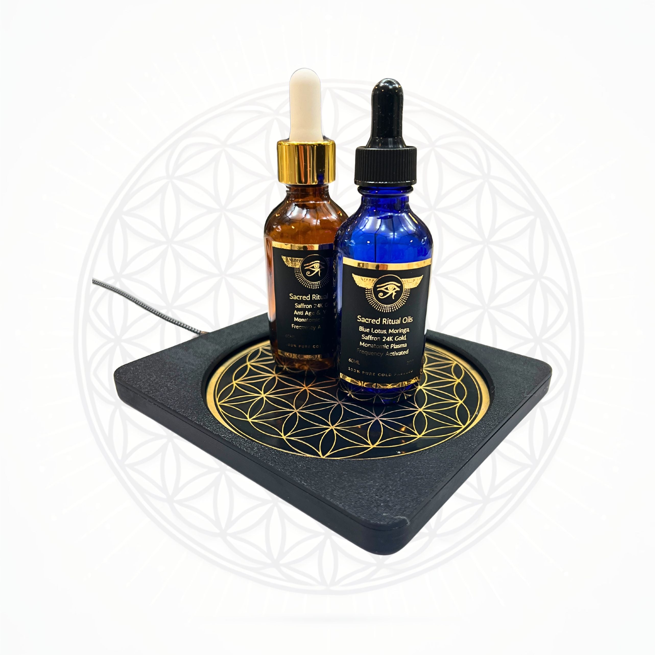Sacred Ritual Oils Metatronic Flower of Life Frequency Imprinter with two essential oil bottles on top
